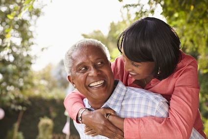 a happy couple. A recent survey found many retirees were staying in the home they lived in before they retired. (Dreamstime/TCA) stay close to home when you retire.