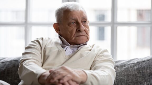 A sad pensive man feeling too old to leave his codependent marriage.