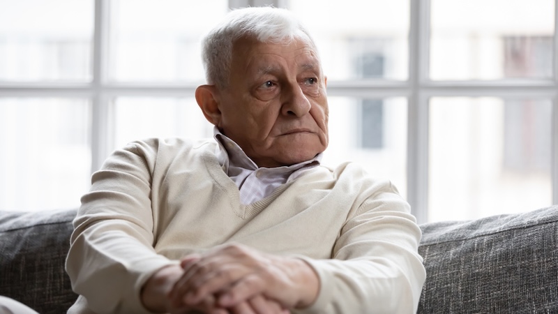 A sad pensive man feeling too old to leave his codependent marriage.