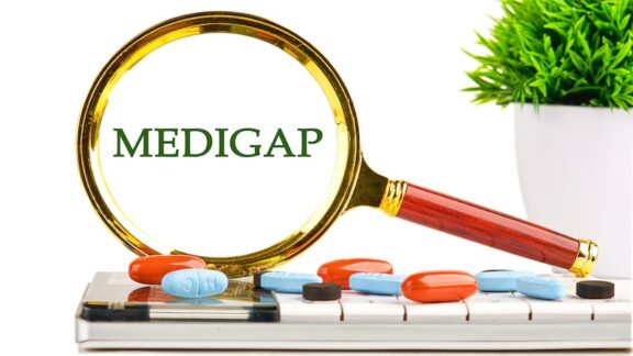 A magnifying glass showing "Medigap" and a variety of pills underneath.